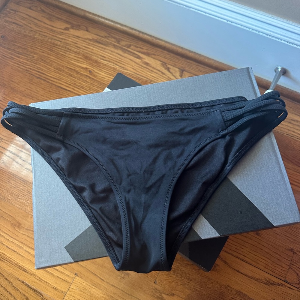 woman’s black bikini bottom size: medium
